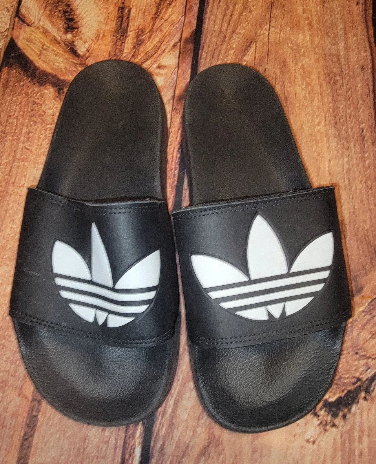 adidas adilette slides nere uomo taglia 9