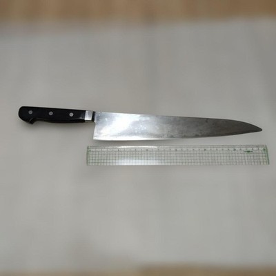 Stainless steel kitchen knife, approximately 30cm long.