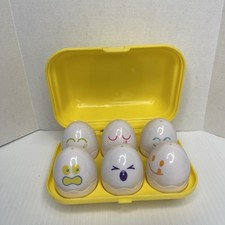 Vintage 1993 Tomy Egg Shape Sorting Hide N Squeak Toy Eggs and Yellow Carton