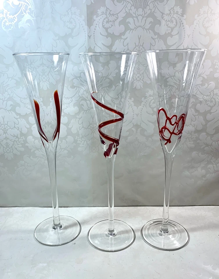 Set Of 3 Clear Swirline Glass Champagne Flutes Red Embossed Mixed Designs - Image 2 of 4