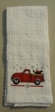 14 X 24 Kitchen towel Embroidered Red Truck Snowflakes Black Dog 264984