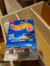      1995 Hot Wheels 577 Police Cruiser Error should be black/white police.  