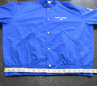 Blue Vtg 90s Polo Sport Ralph Lauren jacket with white snap buttons, pointed collar, and visible “Vtg 90s Polo Sport” text.