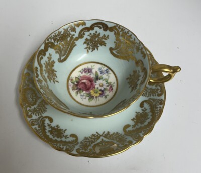 Paragon Cabbage Rose Blue/Gold Teacup And Saucer Double Warrant.