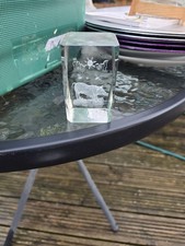 This is a vintage crystal etched paperweight featuring an image of a pig.