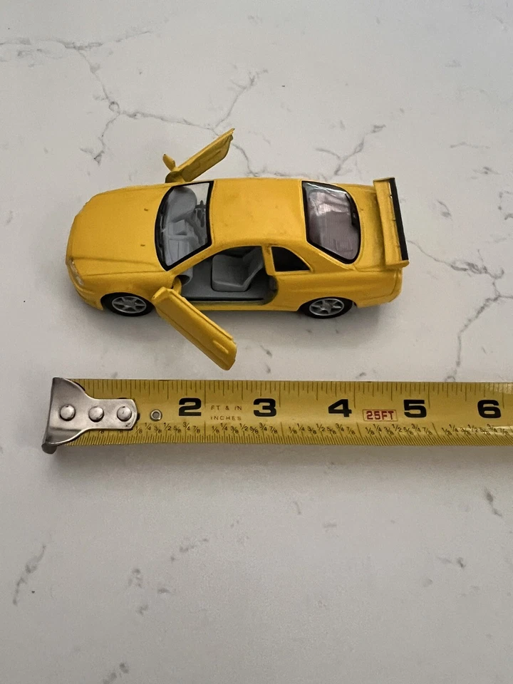 Nissan Skyline GTR R34 Kinsmart escala 1:36 Foto 2 de 4