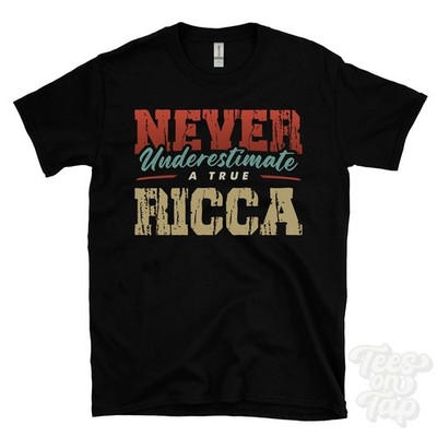 NEVER UNDERSCHIMATE A TRUE RICCA T-SHIRT - Wear Your Name Proudly