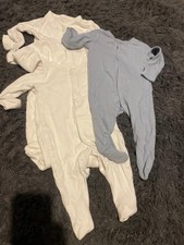 Bundle of 4 baby all in one sleepsuits / baby grows age 0 - 3 months