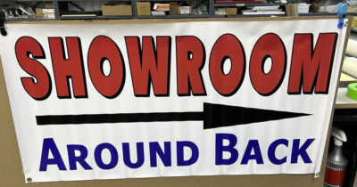 CLEARANCE SALE 2' X 4'  VINYL BANNER SHOWROOM AROUND BACK LEFT ARROW