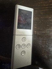 Silver Remote Control with Screen and Directional Buttons