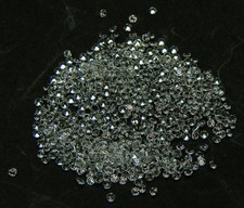 100 PCS. ROUND 1.5 MM. MACHINE CUT WHITE SAPPHIRE LAB CORUNDUM