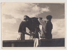 Framing the Horizon Two Young Men Capturing Timeless Moments Beneath Vast Skies