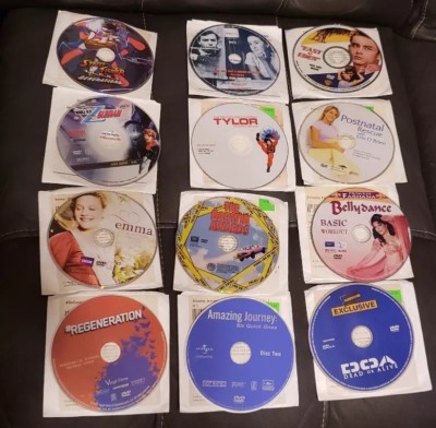 Lot of 12 DVDS without cases just white envelopes most with info on