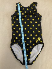 GK velour leotard black Yellow Star Possibly Small girls gymnastics
