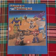 Carpeta escolar vintage Transformers 1985 de 2 bolsillos Hasbo Frito Lay 12x9 pulgadas