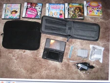 NINTENDO DSI AND  5 NINTENDO GAMES