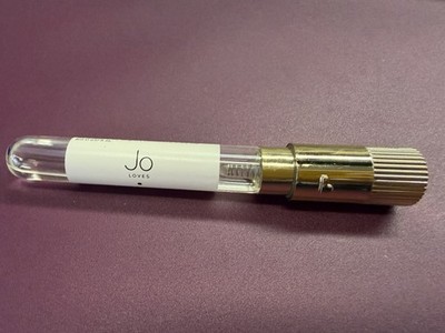 Jo Loves White Rose & Lemon Leaves Eau de Toilette travel-size spray.