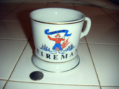 fireman coffee mug graphic shows fireman sounds alarm holding banner''Ever Alert''