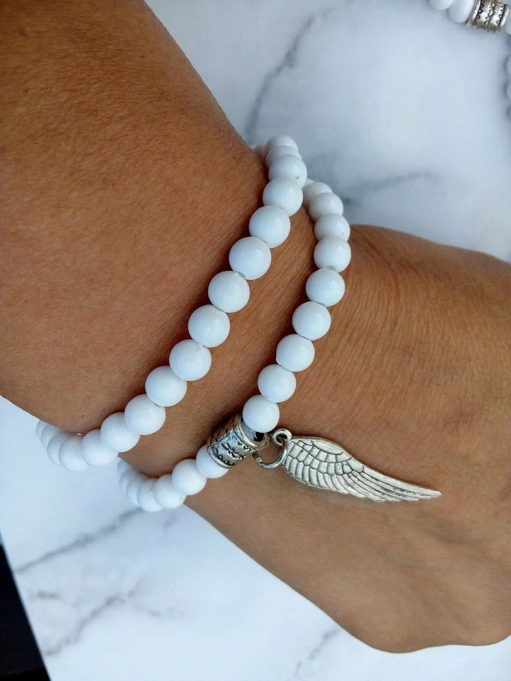 CONJUNTO de pulsera con dije de ala de ángel Tíbet tono plata blanco cuentas elásticas apilables Foto 2 de 2