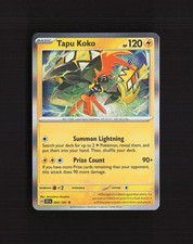 Carta Pokemon rara Tapu Koko 065/191 Surging Sparks Holo quasi nuova