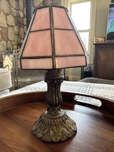 This is a World Bazaars vintage Tiffany-style pink stained glass votive holder.