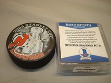 Joe Nieuwendyk Signed Devils Stanley Cup Champs Hockey Puck Beckett BAS COA 1A