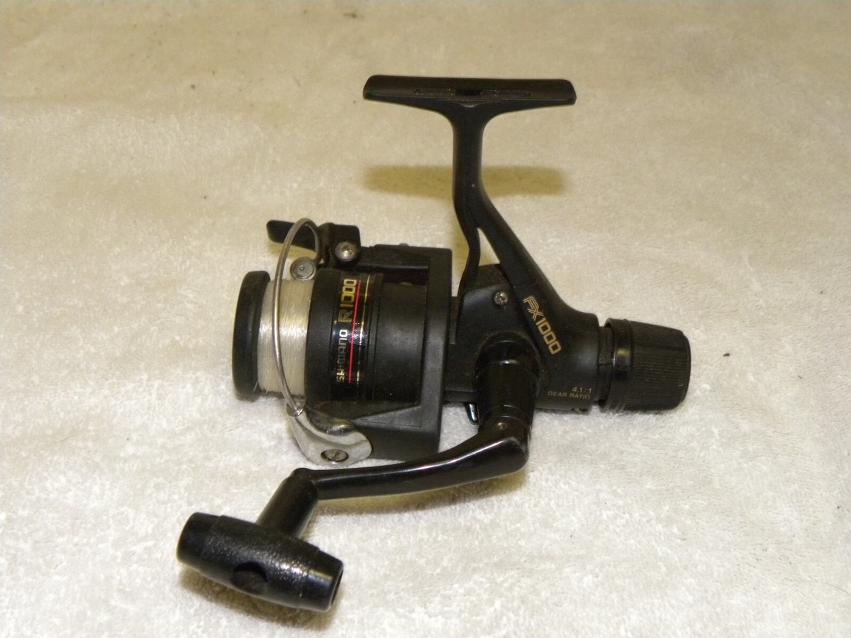 SHIMANO FX 1000 SPINNING REEL- VERY NICE-REAR DRAG-QUICK