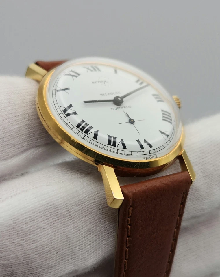 Reloj mecánico Arnex vintage para hombre tono dorado con esfera blanca y números romanos Foto 3 de 4