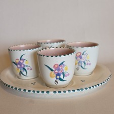 Set of four Poole Pottery Hand Painted Floral Egg Cups and stand