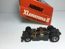 AURORA T-JET (1) NOS  XLERATORS Chassis 2nd Type front wheel ~ BRAND NEW ~ NICE!