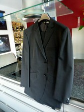 Men's suit size 48, black, unworn, elegant design, resembles tuxedo