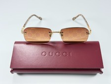 Gucci GG1221S-004 Square Rimless Sunglasses Gold Frame Brown Logo Lens 56mm