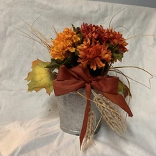 10 fall mums in faux pot with bow and leaves