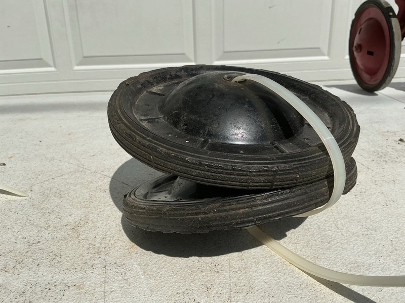 A PAIR OF MUSTANG PEDAL CAR RIMS AND TIRES ORIGINAL PARTS 