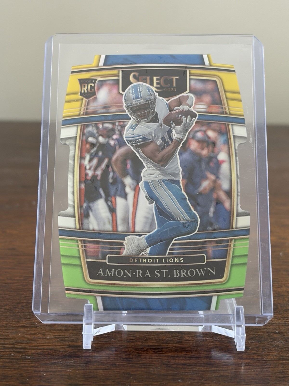 Amon-Ra St. Brown 2021 Panini Select Concourse #73 Green & Yellow Prizm Die-Cut