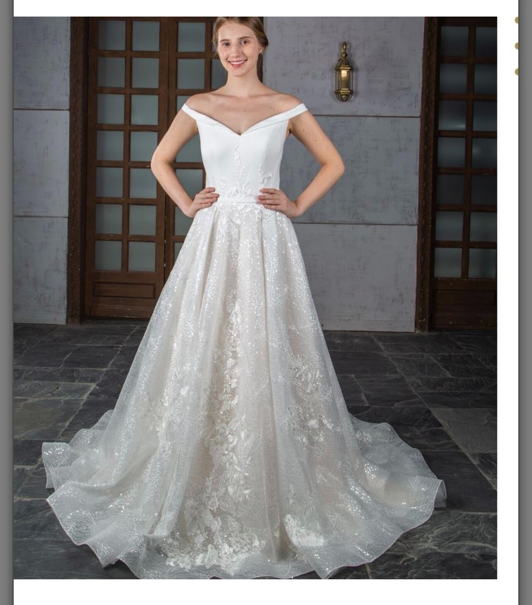 Ivory wedding dress size private design, unworn UK