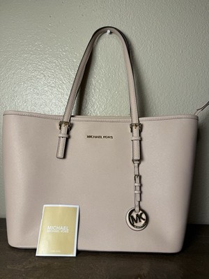 Michael Kors Jet Set Travel Medium Top-Zip Tote Bag in the color Powder Blush.