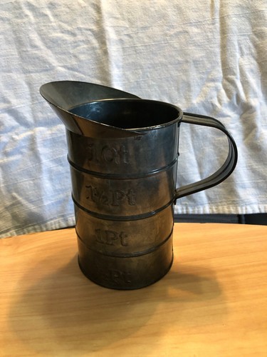 Vintage pint measurement; metal can with handle