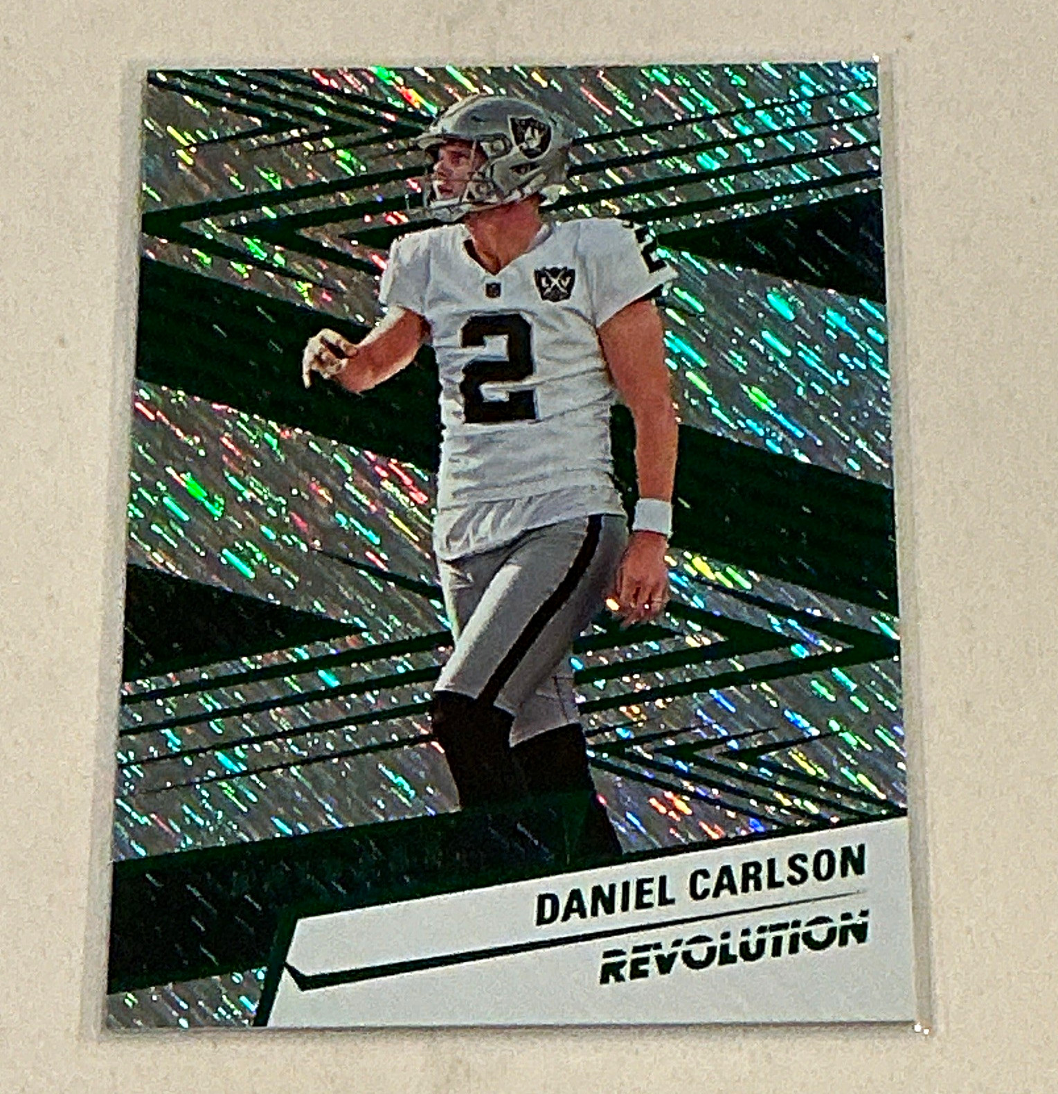 Panini 2025 Revolution Football Daniel Carlson Raiders Storm #102 686/699