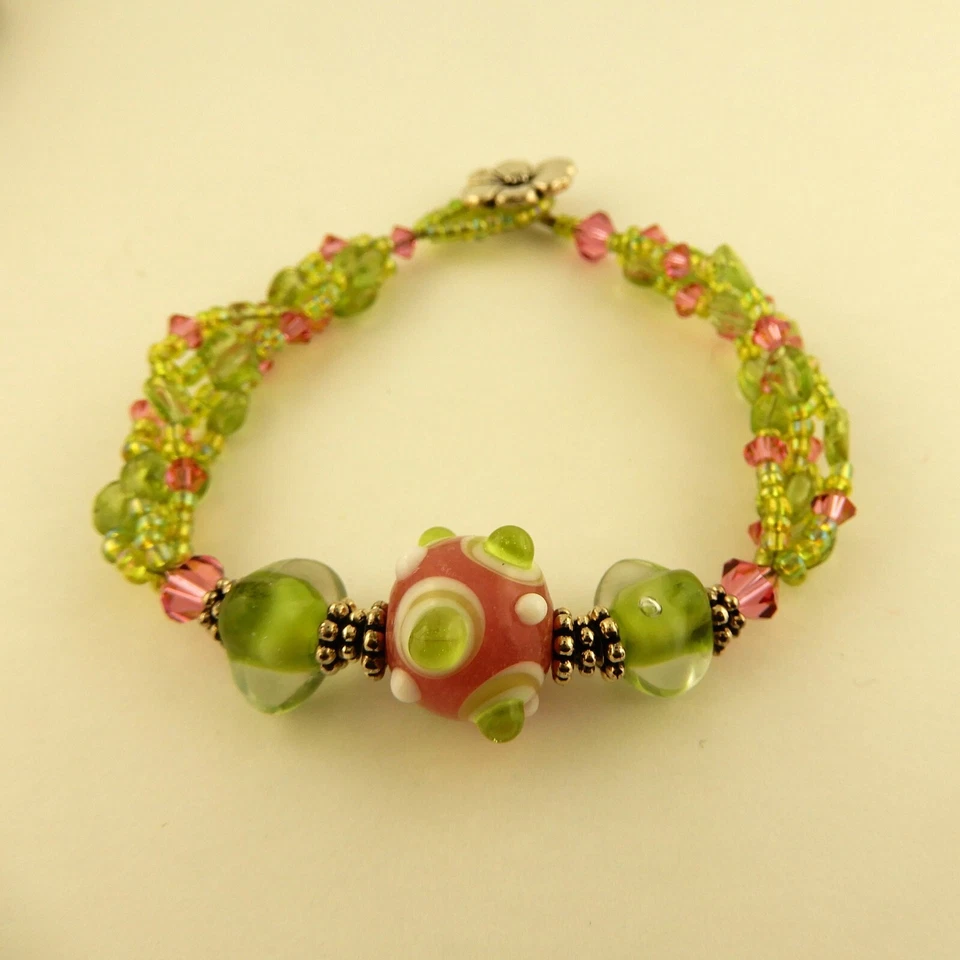 3 strand bracelet made w/ Swarovski, Peridot pink & green beads & flower clasp - Image 3 of 4