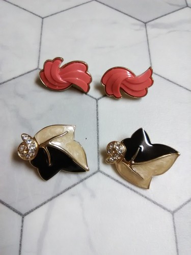 Trifari two pair clip on earrings - black & cream enamel leaf & coral pair