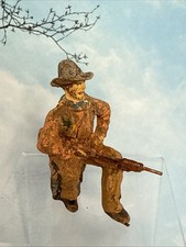 Composition Cowboy Seated With Rifle Unreadable Mark