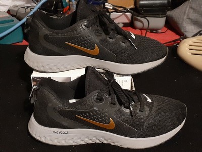 nike legend react black and gold