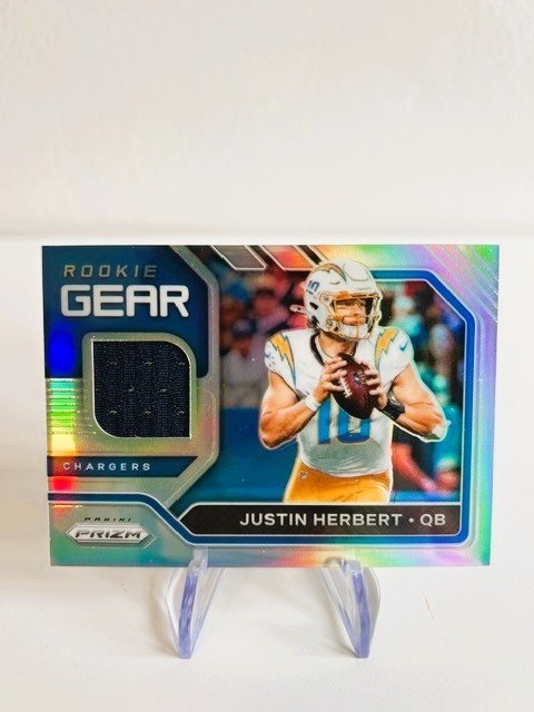 2020 Panini Prizm - Rookie Gear Justin Herbert #19 (MEM, RC)