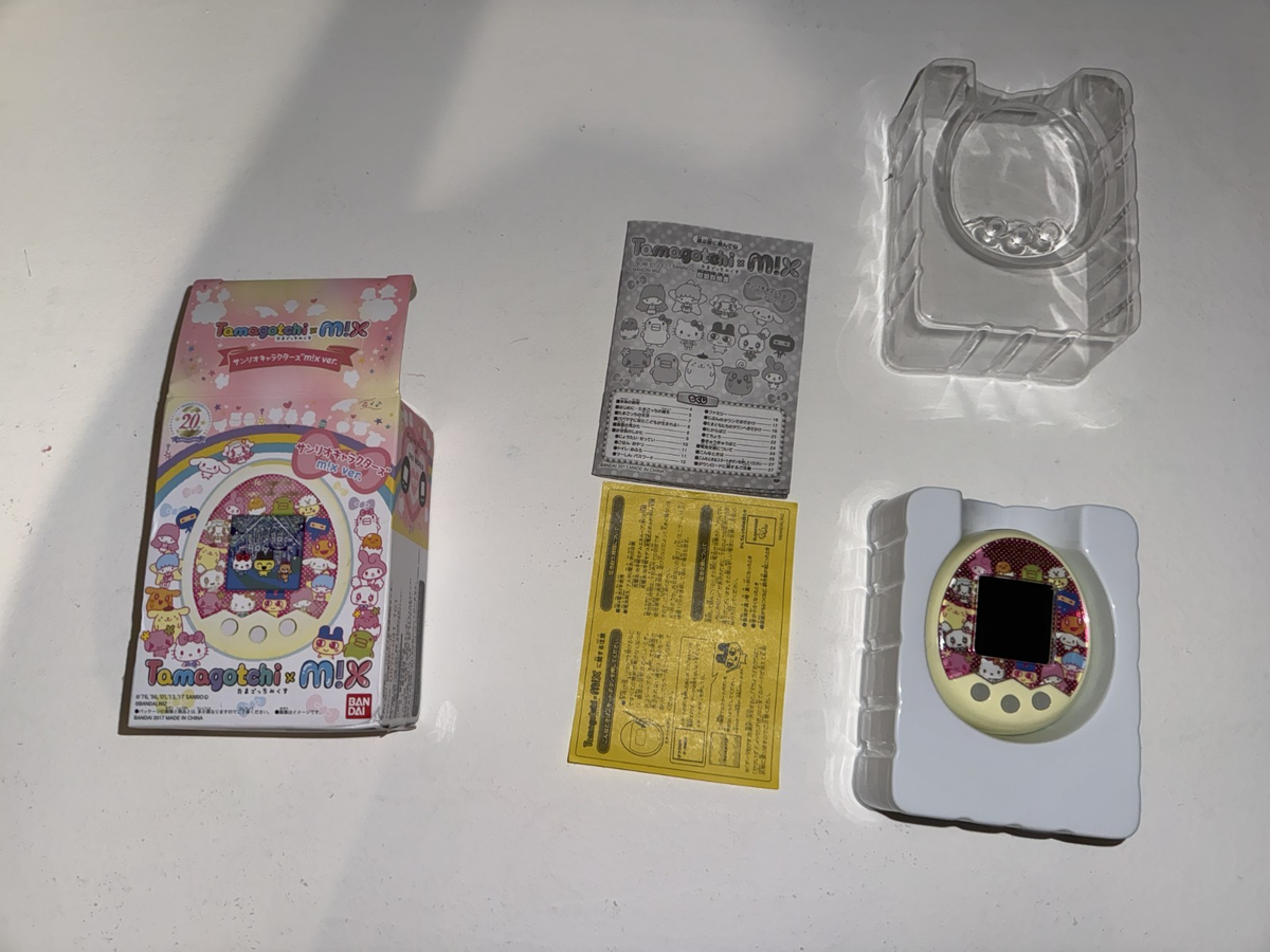 Bandai Tamagotchi m!X Sanrio Characters, yellow white limited