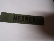 MILITARY PATCH OLDER COMBAT USED NAME TAPE SEW ON SUBDUED SYNTHETIC NAME HEANEY