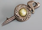 WHITE METAL & CONNEMARA EFFECT STONE SHIELD & SWORD BROOCH
