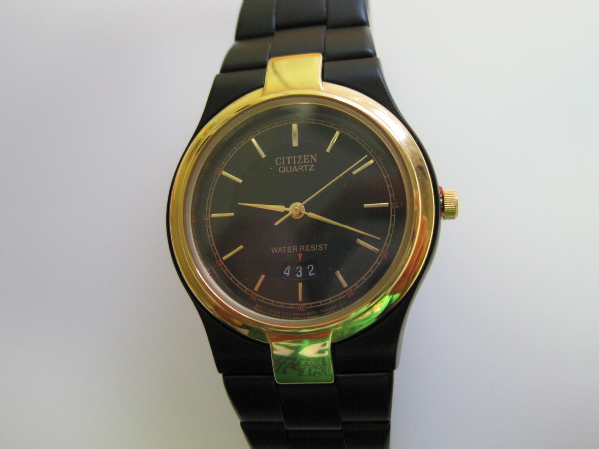 CITIZEN mans black ion and gold plate stainless fancy date 