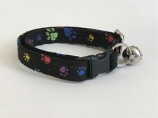 MULTI COLORED PAW PRINTS ON BLACK PRINT ADJUSTABLE BREAKAWAY CAT COLLAR