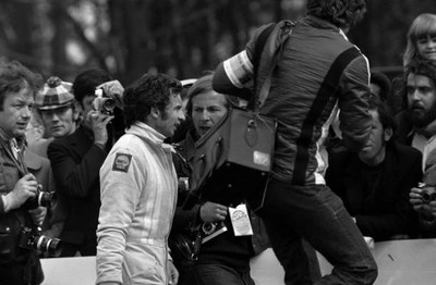 Jean Pierre Beltoise walks back to the pits after the Equipe Matra- Old Photo
